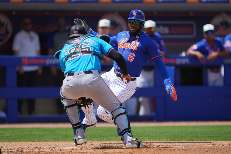 Mar 17, 2024; Port St. Lucie, Florida, USA;  New York Mets designated hitter Starling Marte (6) get tagged out at the plate by Miami Marlins catcher Christian Bethancourt (25) in the second inning at Clover Park. Mandatory Credit: Jim Rassol-USA TODAY Sports