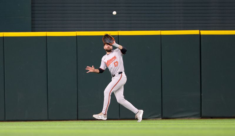 Jul 21, 2024; Arlington, Texas, USA; Baltimore Orioles center fielder Colton Cowser (17) catches a fly ball during the first inning against the Texas Rangers at Globe Life Field. Mandatory Credit: Kevin Jairaj-USA TODAY Sports