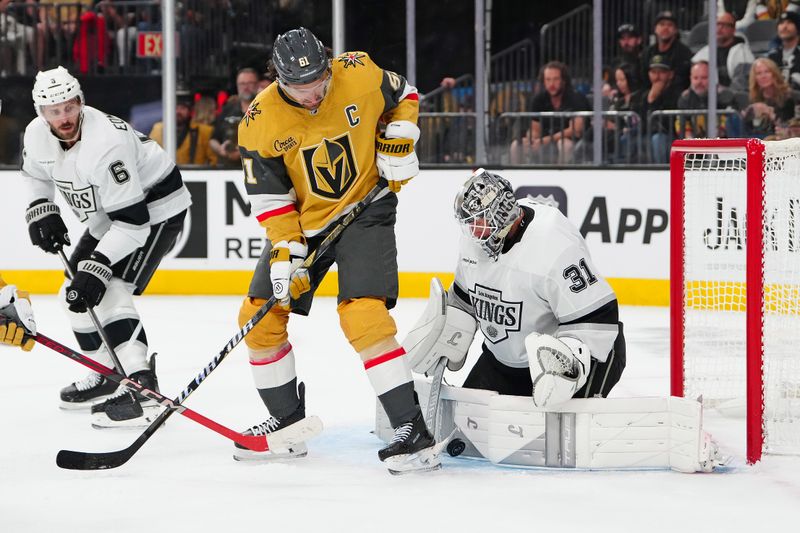 Oct 8, 2025; Las Vegas, Nevada, USA; Vegas Golden Knights right wing Mark Stone (61) deflects the puck against Los Angeles Kings goaltender Anton Forsberg (31) during the second period at T-Mobile Arena. Mandatory Credit: Stephen R. Sylvanie-Imagn Images