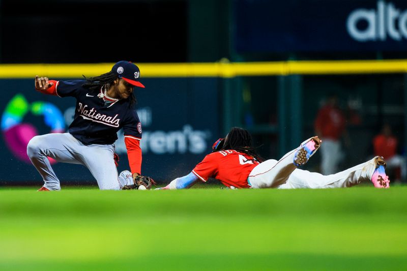 May 3, 2025; Cincinnati, Ohio, USA; Washington Nationals shortstop CJ Abrams (5) tags Cincinnati Reds shortstop Elly De La Cruz (44) out at second on a steal in the seventh inning at Great American Ball Park. Mandatory Credit: Katie Stratman-Imagn Images