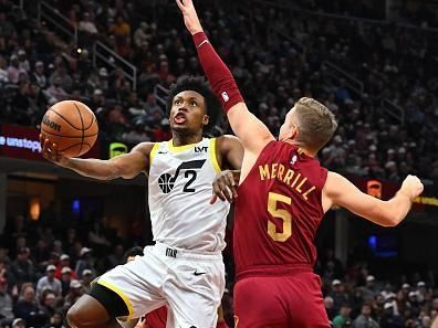 CLEVELAND, OHIO - DECEMBER 20: Collin Sexton #2 of the Utah Jazz shoots over Sam Merrill #5 of the Cleveland Cavaliers during the third quarter at Rocket Mortgage Fieldhouse on December 20, 2023 in Cleveland, Ohio. The Cavaliers defeated the Jazz 124-116. NOTE TO USER: User expressly acknowledges and agrees that, by downloading and or using this photograph, User is consenting to the terms and conditions of the Getty Images License Agreement. (Photo by Jason Miller/Getty Images)