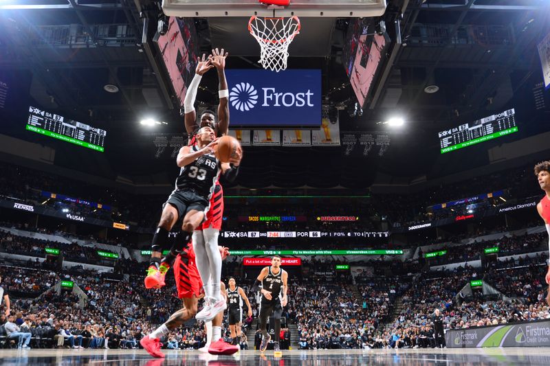 SAN ANTONIO, TX - JANUARY 26:  Tre Jones #33 of the San Antonio Spurs drives to the basket during the game against the Portland Trail Blazers on January 26, 2024 at the Frost Bank Center in San Antonio, Texas. NOTE TO USER: User expressly acknowledges and agrees that, by downloading and or using this photograph, user is consenting to the terms and conditions of the Getty Images License Agreement. Mandatory Copyright Notice: Copyright 2024 NBAE (Photos by Michael Gonzales/NBAE via Getty Images)