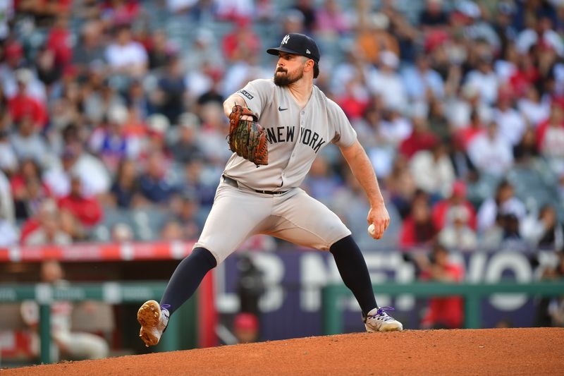 May 27, 2025; Anaheim, California, USA; New York Yankees pitcher Carlos Rodón (55) throws against the Los Angeles Angels during the first inning at Angel Stadium. Mandatory Credit: Gary A. Vasquez-Imagn Images