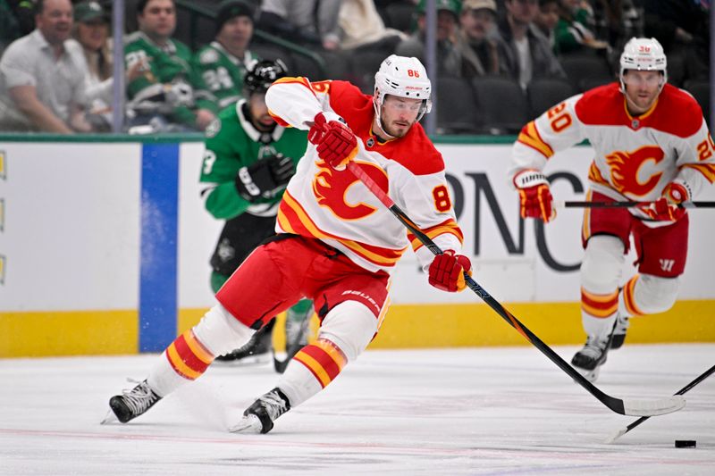 Mar 6, 2025; Dallas, Texas, USA; Calgary Flames left wing Joel Farabee (86) scores a goal on a breakaway against the Dallas Stars during the first period at the American Airlines Center. Mandatory Credit: Jerome Miron-Imagn Images