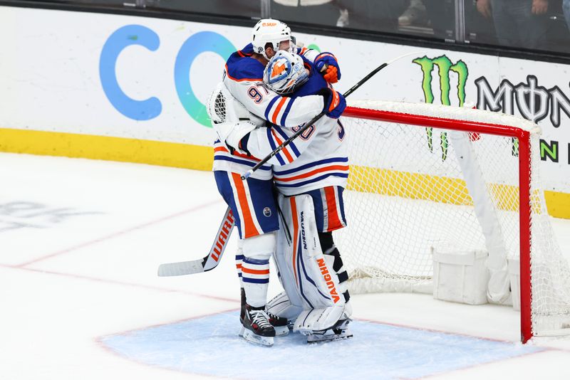 Feb 9, 2024; Anaheim, California, USA; Edmonton Oilers center Connor McDavid (97) and goaltender Calvin Pickard (30) embrace after the Edmonton Oilers defeat the Anaheim Ducks at Honda Center. Mandatory Credit: Jessica Alcheh-USA TODAY Sports