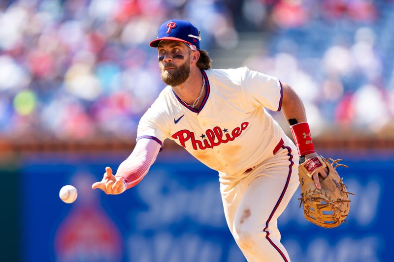 Jun 19, 2024; Philadelphia, Pennsylvania, USA; Philadelphia Phillies first base Bryce Harper (3) field a ground ball during the ninth inning against the San Diego Padres at Citizens Bank Park. Mandatory Credit: Bill Streicher-USA TODAY Sports