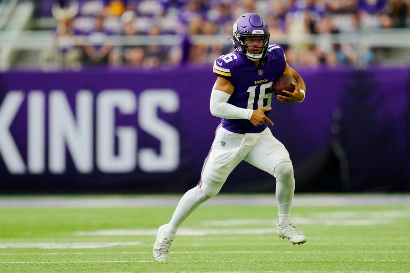 Minnesota Vikings quarterback Jaren Hall (16) scrambles against the Arizona Cardinals during the first half of an NFL preseason football game, Saturday, Aug. 26, 2023, in Minneapolis. (AP Photo/Abbie Parr)