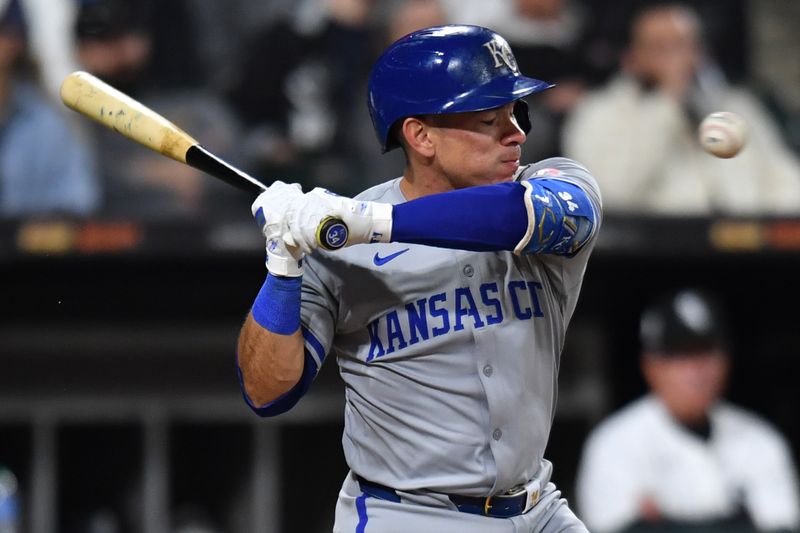 Apr 15, 2024; Chicago, Illinois, USA; Kansas City Royals catcher Freddy Fermin (34) avoids getting hit by a pitch during the eighth inning against the Chicago White Sox at Guaranteed Rate Field. Mandatory Credit: Patrick Gorski-USA TODAY Sports