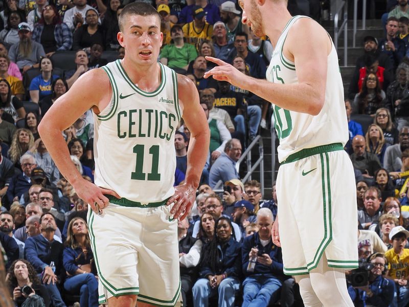 INDIANAPOLIS, IN - OCTOBER 30: Sam Hauser #30 speaks with Payton Pritchard #11 of the Boston Celtics during the game on October 30, 2024 at Gainbridge Fieldhouse in Indianapolis, Indiana. NOTE TO USER: User expressly acknowledges and agrees that, by downloading and or using this Photograph, user is consenting to the terms and conditions of the Getty Images License Agreement. Mandatory Copyright Notice: Copyright 2024 NBAE (Photo by Ron Hoskins/NBAE via Getty Images)