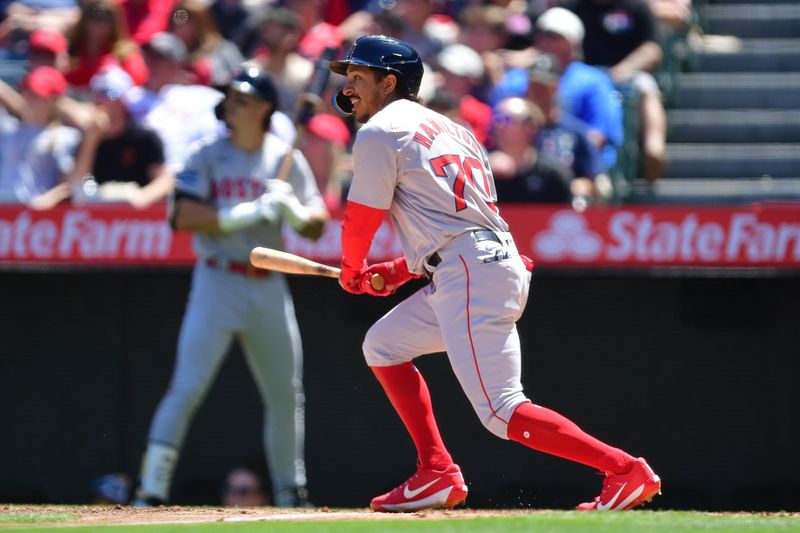 Apr 7, 2024; Anaheim, California, USA; Boston Red Sox shortstop David Hamilton (70) hits a solo home run against the Los Angeles Angels during the third inning at Angel Stadium. Mandatory Credit: Gary A. Vasquez-USA TODAY Sports