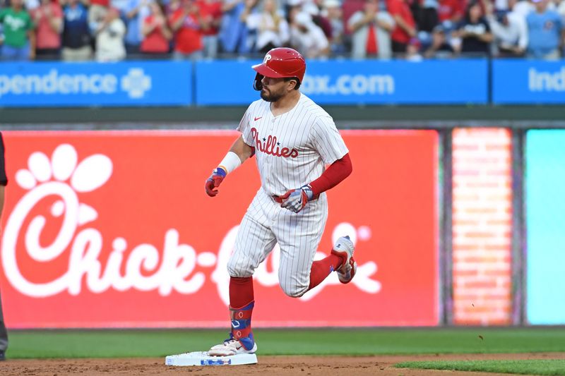 Sep 10, 2024; Philadelphia, Pennsylvania, USA; Philadelphia Phillies designated hitter Kyle Schwarber (12) celebrates his home run during the first inning against the Tampa Bay Rays at Citizens Bank Park. Mandatory Credit: Eric Hartline-Imagn Images