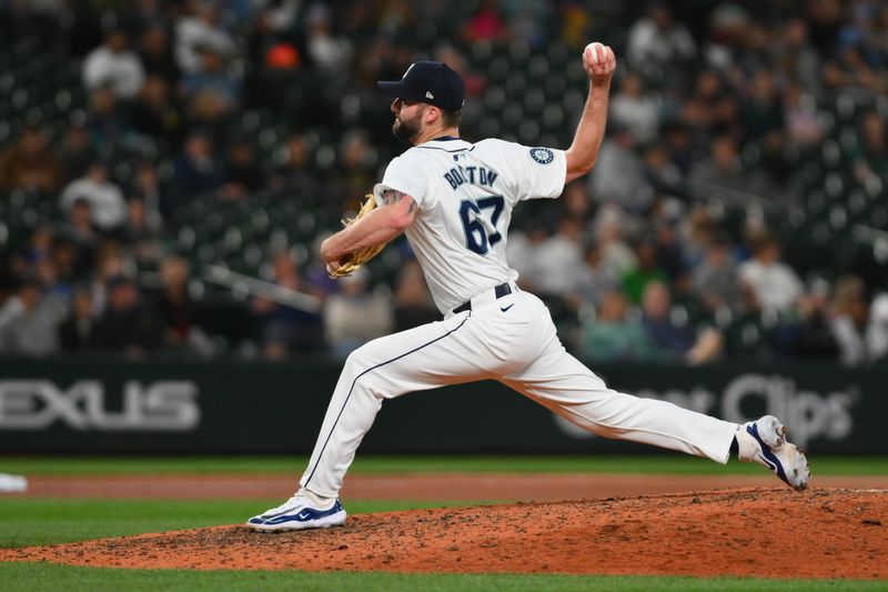 May 14, 2024; Seattle, Washington, USA; Seattle Mariners relief pitcher Cody Bolton (67) pitches to the Kansas City Royals during the ninth inning at T-Mobile Park. Mandatory Credit: Steven Bisig-USA TODAY Sports