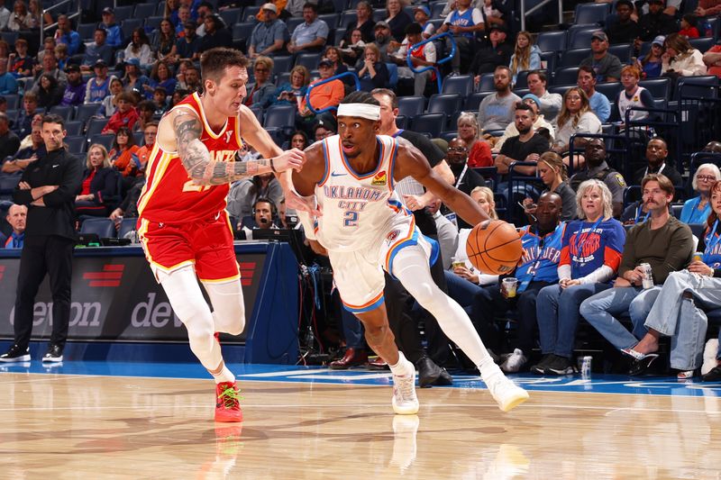 OKLAHOMA CITY, OK - OCTOBER 17: Shai Gilgeous-Alexander #2 of the Oklahoma City Thunder drives to the basket during the game against the Atlanta Hawks on October 17, 2024 at Paycom Arena in Oklahoma City, Oklahoma. NOTE TO USER: User expressly acknowledges and agrees that, by downloading and or using this photograph, User is consenting to the terms and conditions of the Getty Images License Agreement. Mandatory Copyright Notice: Copyright 2024 NBAE (Photo by Zach Beeker/NBAE via Getty Images)