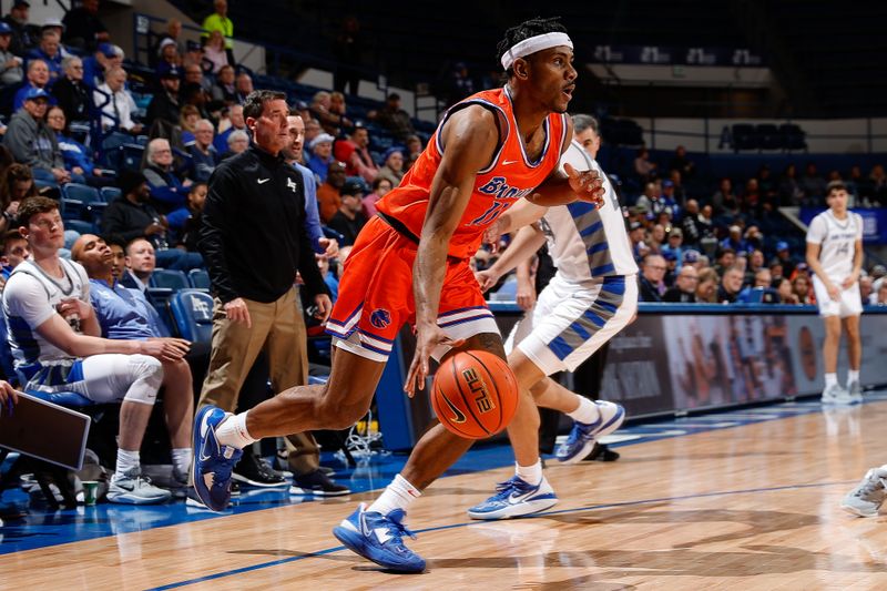Jan 31, 2023; Colorado Springs, Colorado, USA; Boise State Broncos guard Chibuzo Agbo (11) controls the ball in the first half against the Air Force Falcons at Clune Arena. Mandatory Credit: Isaiah J. Downing-USA TODAY Sports