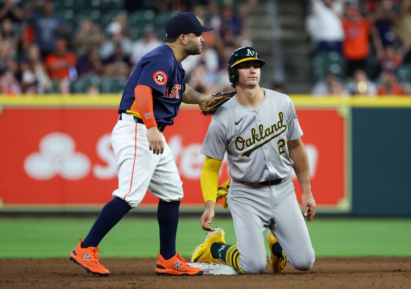 May 15, 2024; Houston, Texas, USA; Houston Astros second baseman Jose Altuve (27) tags out Oakland Athletics first base Tyler Soderstrom (21) at second base in the ninth inning at Minute Maid Park. Mandatory Credit: Thomas Shea-USA TODAY Sports