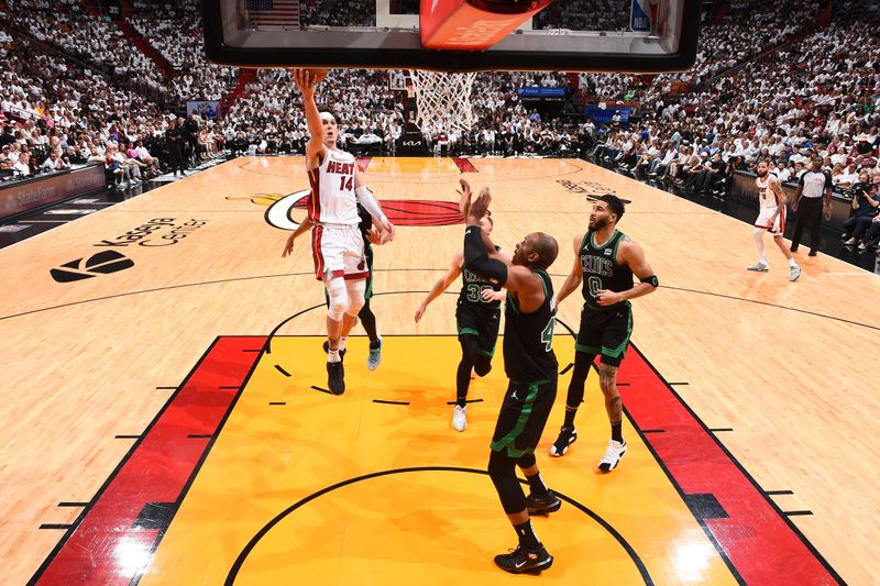 MIAMI, FL - APRIL 27: Tyler Herro #14 of the Miami Heat drives to the basket during the game against the Boston Celtics during Round 1 Game 3 of the 2024 NBA Playoffs on April 27, 2024 at Kaseya Center in Miami, Florida. NOTE TO USER: User expressly acknowledges and agrees that, by downloading and or using this Photograph, user is consenting to the terms and conditions of the Getty Images License Agreement. Mandatory Copyright Notice: Copyright 2024 NBAE (Photo by Brian Babineau/NBAE via Getty Images)