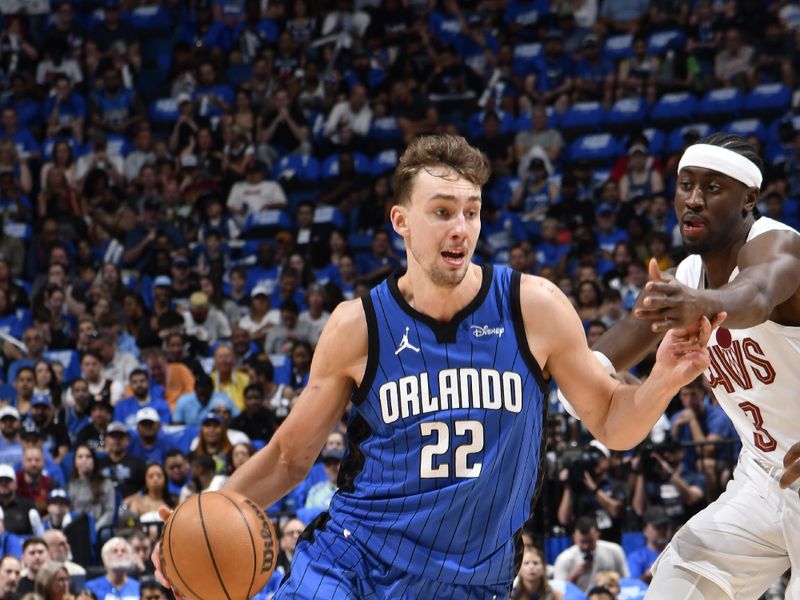 ORLANDO, FL - APRIL 27: Franz Wagner #22 of the Orlando Magic dribbles the ball during the game against the Cleveland Cavaliers during Round 1 Game 4 of the 2024 NBA Playoffs on April 27, 2024 at the Kia Center in Orlando, Florida. NOTE TO USER: User expressly acknowledges and agrees that, by downloading and or using this photograph, User is consenting to the terms and conditions of the Getty Images License Agreement. Mandatory Copyright Notice: Copyright 2024 NBAE (Photo by Fernando Medina/NBAE via Getty Images)