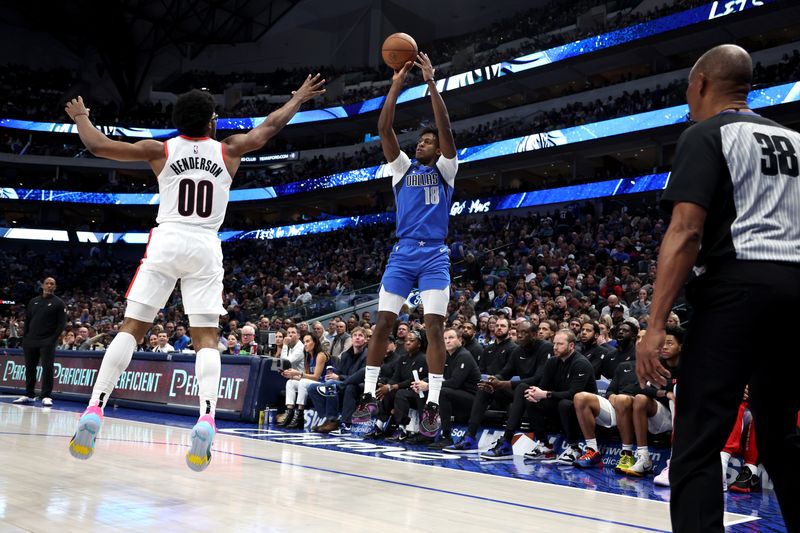 DALLAS, TEXAS - JANUARY 05: Olivier-Maxence Prosper #18 of the Dallas Mavericks shoots the ball against Scoot Henderson #00 of the Portland Trail Blazers in the second half at American Airlines Center on January 05, 2024 in Dallas, Texas. NOTE TO USER: User expressly acknowledges and agrees that, by downloading and or using this photograph, User is consenting to the terms and conditions of the Getty Images License Agreement. (Photo by Tim Heitman/Getty Images)