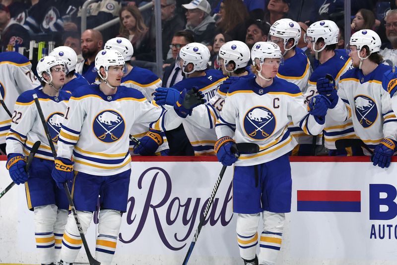 Mar 23, 2025; Winnipeg, Manitoba, CAN; Buffalo Sabres defenseman Rasmus Dahlin (26) celebrates after a goal against the Winnipeg Jets in the second period at Canada Life Centre. Mandatory Credit: James Carey Lauder-Imagn Images