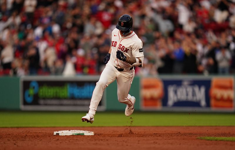 May 13, 2024; Boston, Massachusetts, USA; Boston Red Sox designated hitter Tyler O'Neill (17) hits a three run home run against the Tampa Bay Rays in the first inning at Fenway Park. Mandatory Credit: David Butler II-USA TODAY Sports