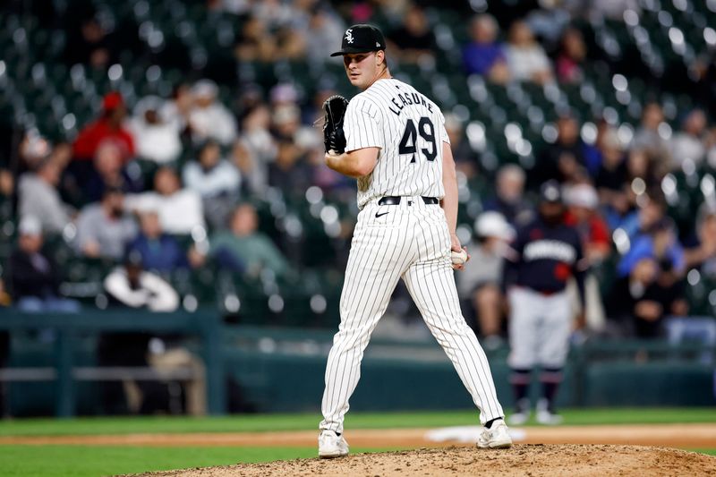 Apr 30, 2024; Chicago, Illinois, USA; Chicago White Sox relief pitcher Jordan Leasure (49) delivers a pitch against the Minnesota Twins during the eight inning at Guaranteed Rate Field. Mandatory Credit: Kamil Krzaczynski-USA TODAY Sports