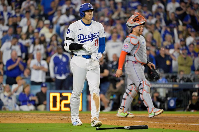 Oct 20, 2024; Los Angeles, California, USA; Los Angeles Dodgers designated hitter Shohei Ohtani (17) reacts after a walk in the eighth inning against the New York Mets during game six of the NLCS for the 2024 MLB playoffs at Dodger Stadium. Mandatory Credit: Jayne Kamin-Oncea-Imagn Images