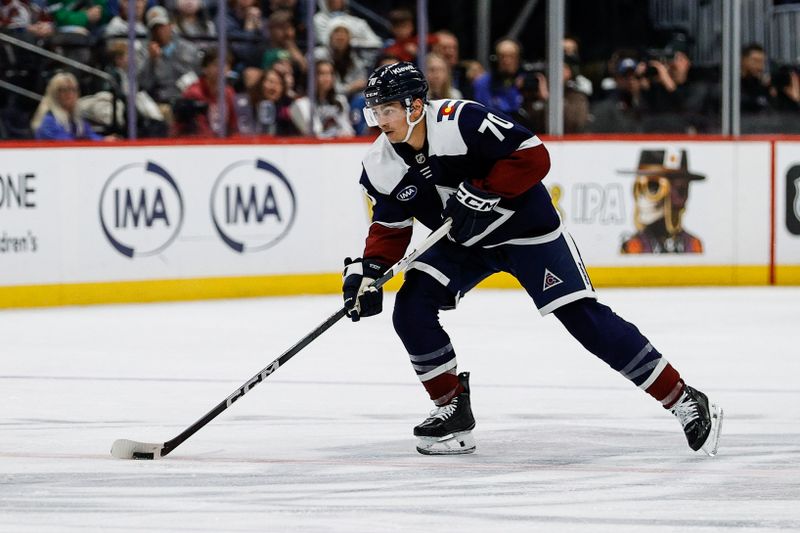 Mar 16, 2025; Denver, Colorado, USA; Colorado Avalanche defenseman Sam Malinski (70) controls the puck in the second period against the Dallas Stars at Ball Arena. Mandatory Credit: Isaiah J. Downing-Imagn Images