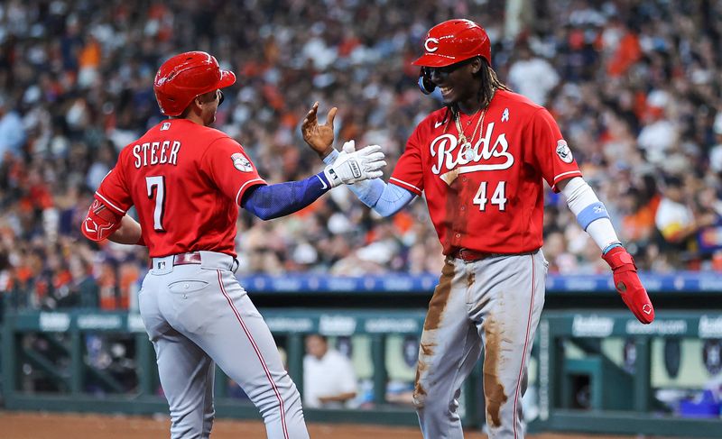 Jun 18, 2023; Houston, Texas, USA; Cincinnati Reds first baseman Spencer Steer (7) celebrates with shortstop Elly De La Cruz (44) after hitting a home run during the sixth inning against the Houston Astros at Minute Maid Park. Mandatory Credit: Troy Taormina-USA TODAY Sports