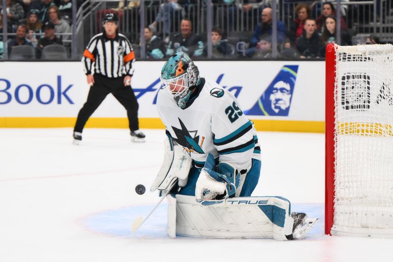 Nov 30, 2024; Seattle, Washington, USA; San Jose Sharks goaltender Mackenzie Blackwood (29) blocks a goal shot against the Seattle Kraken during the second period at Climate Pledge Arena. Mandatory Credit: Steven Bisig-Imagn Images