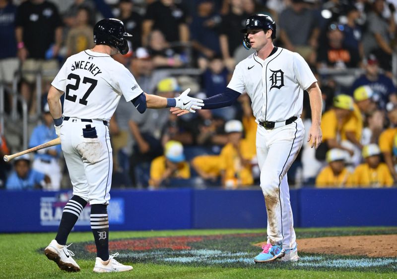 Aug 18, 2024; Williamsport, Pennsylvania, USA; Detroit Tigers infielder Colt Keith (33) reacts with infielder Trey Sweeney (27) after scoring against the New York Yankees in the ninth inning at BB&T Ballpark at Historic Bowman Field. Mandatory Credit: Kyle Ross-USA TODAY Sports