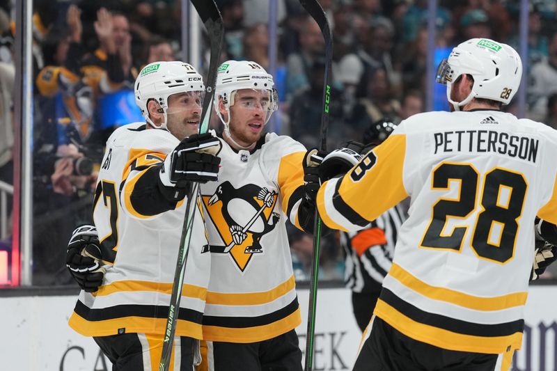 Nov 4, 2023; San Jose, California, USA; Pittsburgh Penguins right wing Reilly Smith (center) celebrates with right wing Bryan Rust (left) and defenseman Marcus Pettersson (28) after scoring a goal against the San Jose Sharks during the first period at SAP Center at San Jose. Mandatory Credit: Darren Yamashita-USA TODAY Sports