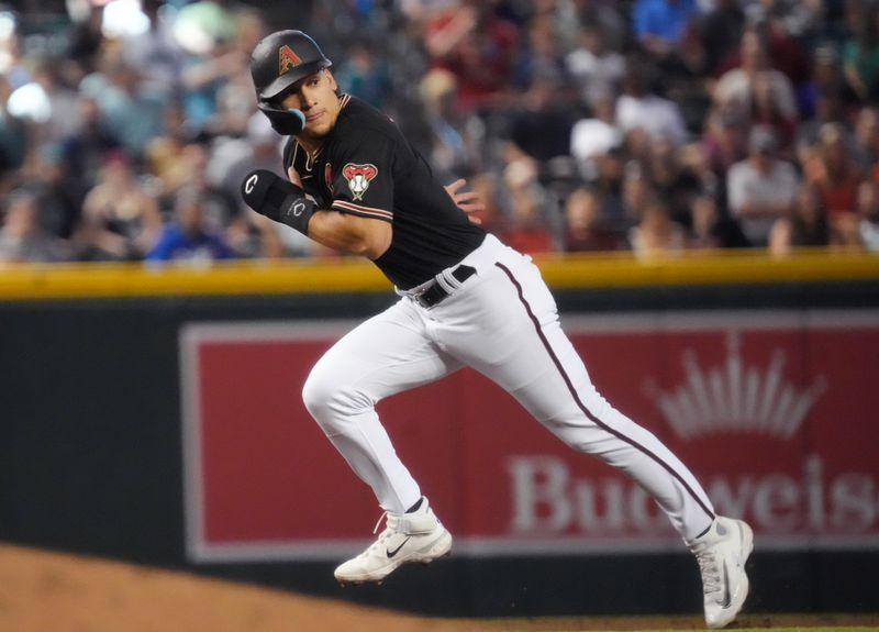 Jul 9, 2023; Phoenix, Arizona, USA;  Arizona Diamondbacks Alek Thomas (5) takes off for third base against the Pittsburgh Pirates  at Chase Field. Mandatory Credit: Joe Rondone-USA TODAY Sports