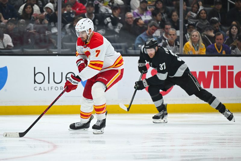 Feb 28, 2026; Los Angeles, California, USA; Calgary Flames defenseman Kevin Bahl (7) skates with the puck during the second period against the Los Angeles Kings at Crypto.com Arena. Mandatory Credit: Griffin Hooper-Imagn Images