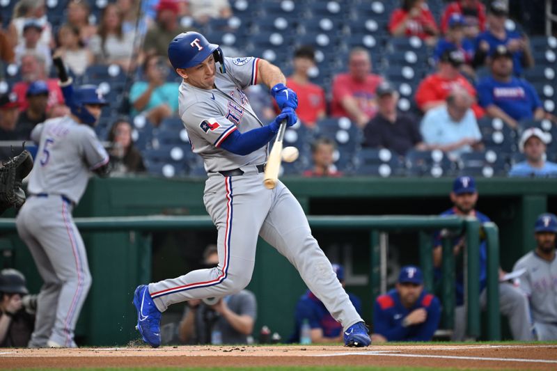 Jun 6, 2025; Washington, District of Columbia, USA; Texas Rangers left fielder Wyatt Langford (36) hits the ball into play during the first inning against the Washington Nationals at Nationals Park. Mandatory Credit: Rafael Suanes-Imagn Images