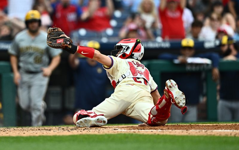 Jun 5, 2024; Philadelphia, Pennsylvania, USA; Philadelphia Phillies catcher Garrett Stubbs (21) gestures after recording an out at home against the Milwaukee Brewers in the seventh inning at Citizens Bank Park. Mandatory Credit: Kyle Ross-USA TODAY Sports