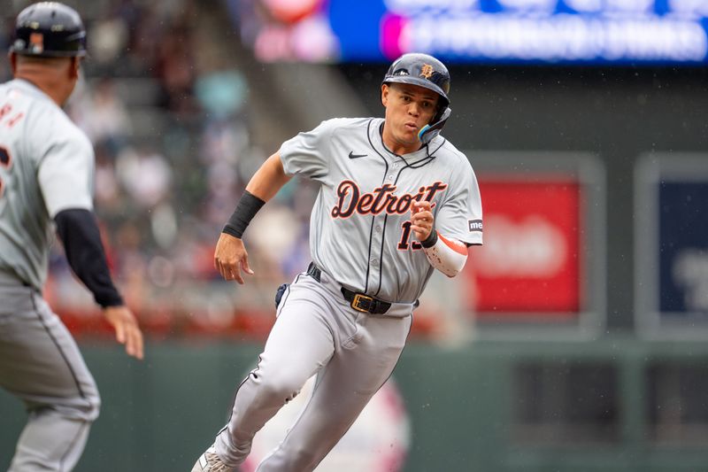 Jul 4, 2024; Minneapolis, Minnesota, USA; Detroit Tigers third baseman Gio Urshela (13) rounds third base on his way to score in the second inning against the Minnesota Twins at Target Field. Mandatory Credit: Matt Blewett-USA TODAY Sports