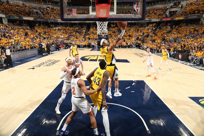 INDIANAPOLIS, IN - MAY 17: Andrew Nembhard #2 of the Indiana Pacers drives to the basket during the game against the New York Knicks during Round 2 Game 6 of the 2024 NBA Playoffs on May 17, 2024 at Gainbridge Fieldhouse in Indianapolis, Indiana. NOTE TO USER: User expressly acknowledges and agrees that, by downloading and or using this Photograph, user is consenting to the terms and conditions of the Getty Images License Agreement. Mandatory Copyright Notice: Copyright 2024 NBAE (Photo by Nathaniel S. Butler/NBAE via Getty Images)