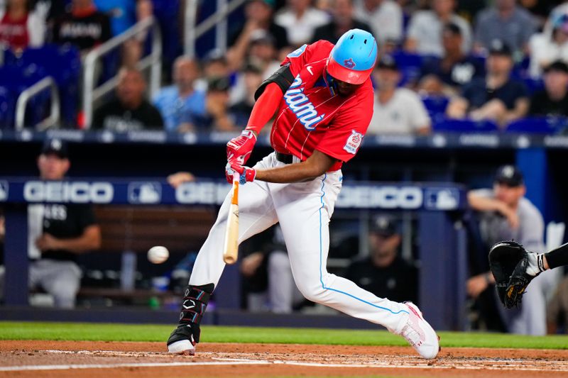 Aug 12, 2023; Miami, Florida, USA; Miami Marlins right fielder Jesus Sanchez (7) hits a single against the New York Yankees during the first inning at loanDepot Park. Mandatory Credit: Rich Storry-USA TODAY Sports