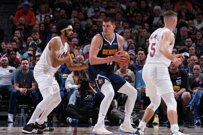 DENVER, CO - MARCH 31: Nikola Jokic #15 of the Denver Nuggets looks on during the game against the Cleveland Cavaliers on March 31, 2024 at the Ball Arena in Denver, Colorado. NOTE TO USER: User expressly acknowledges and agrees that, by downloading and/or using this Photograph, user is consenting to the terms and conditions of the Getty Images License Agreement. Mandatory Copyright Notice: Copyright 2024 NBAE (Photo by Garrett Ellwood/NBAE via Getty Images)