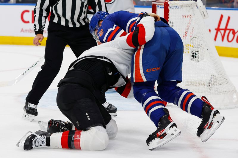 Jan 20, 2026; Edmonton, Alberta, CAN; Edmonton Oilersforward Vasily Podkolzin (92) and New Jersey Devils defensemen John Kovacevic (8) fight during the first period at Rogers Place. Mandatory Credit: Perry Nelson-Imagn Images
