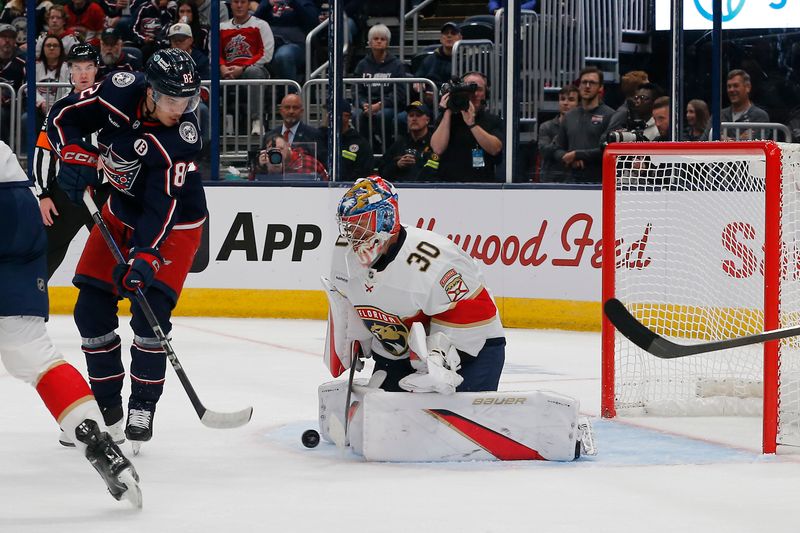 Oct 15, 2024; Columbus, Ohio, USA; Florida Panthers goalie Spencer Knight (30) makes a save on the shot from Columbus Blue Jackets left wing Mikael Pyyhtia (82) during the second period at Nationwide Arena. Mandatory Credit: Russell LaBounty-Imagn Images