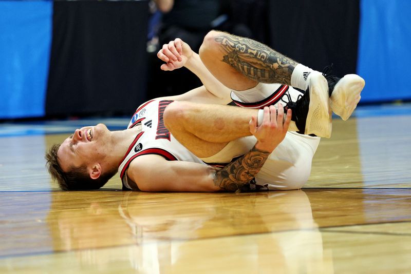 Mar 20, 2025; Lexington, KY, USA; Louisville Cardinals guard Reyne Smith (6) reacts after being injured during the second half against the Louisville Cardinals in the first round of the NCAA Tournament at Rupp Arena. Mandatory Credit: Jordan Prather-Imagn Images