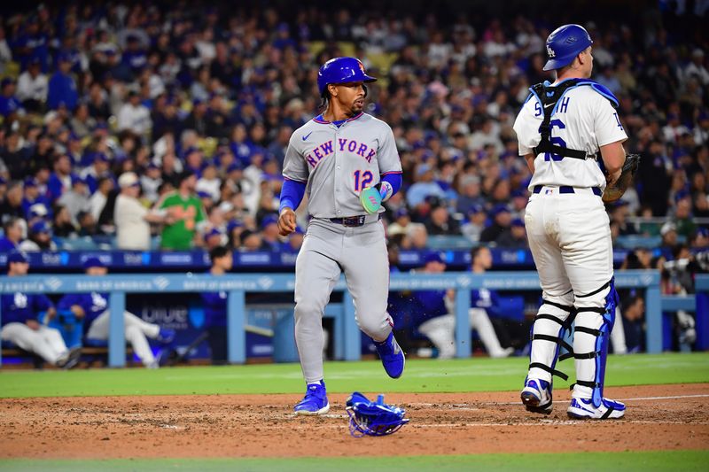 June 3, 2025; Los Angeles, California, USA; New York Mets shortstop Francisco Lindor (12) scores a run against the Los Angeles Dodgers during the fifth inning at Dodger Stadium. Mandatory Credit: Gary A. Vasquez-Imagn Images