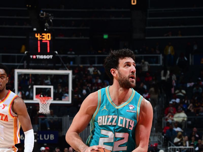 ATLANTA, GA - MARCH 23: Vasilije Micic #22 of the Charlotte Hornets  dribbles the ball during the game against the Atlanta Hawks on March 23, 2024 at State Farm Arena in Atlanta, Georgia.  NOTE TO USER: User expressly acknowledges and agrees that, by downloading and/or using this Photograph, user is consenting to the terms and conditions of the Getty Images License Agreement. Mandatory Copyright Notice: Copyright 2024 NBAE (Photo by Scott Cunningham/NBAE via Getty Images)