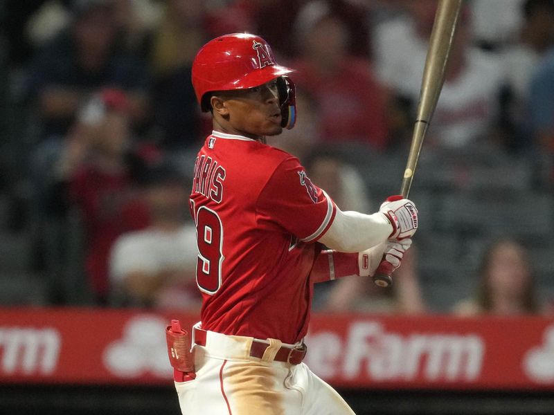 Sep 7, 2023; Anaheim, California, USA; Los Angeles Angels shortstop Kyren Paris (19) follows through on a run-scoring single in the ninth inning against the Cleveland Guardians at Angel Stadium. Mandatory Credit: Kirby Lee-USA TODAY Sports