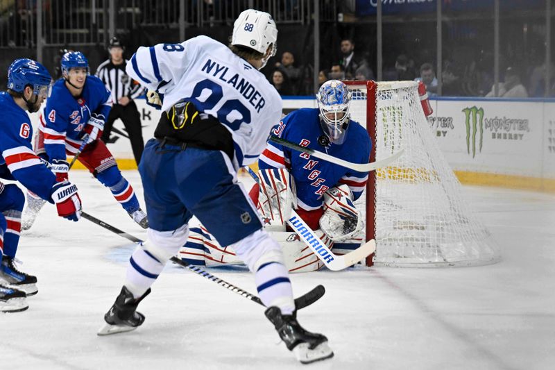 Mar 20, 2025; New York, New York, USA;  New York Rangers goaltender Igor Shesterkin (31) makes a save on a shot from Toronto Maple Leafs right wing William Nylander (88) during the third period at Madison Square Garden. Mandatory Credit: Dennis Schneidler-Imagn Images