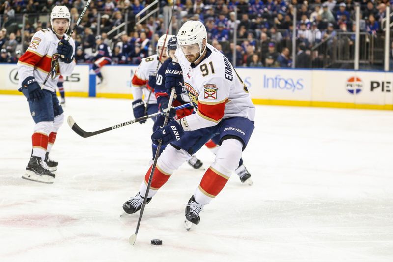 Mar 23, 2024; New York, New York, USA; Florida Panthers defenseman Oliver Ekman-Larsson (91) controls the puck in the second period against the New York Rangers at Madison Square Garden. Mandatory Credit: Wendell Cruz-USA TODAY Sports