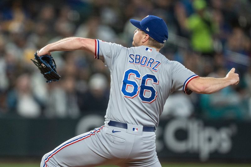 Sep 30, 2023; Seattle, Washington, USA; Texas Rangers reliever Josh Sborz (66) delivers a pitch during the sixth inning against the Seattle Mariners at T-Mobile Park. Mandatory Credit: Stephen Brashear-USA TODAY Sports