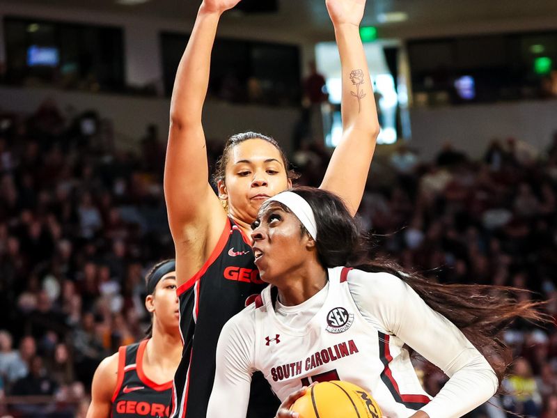 Feb 26, 2023; Columbia, South Carolina, USA; South Carolina Gamecocks forward Laeticia Amihere (15) drives into Georgia Lady Bulldogs forward Javyn Nicholson (35) in the first half at Colonial Life Arena. Mandatory Credit: Jeff Blake-USA TODAY Sports