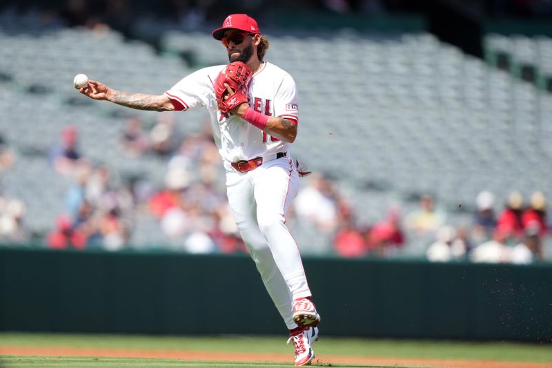 Sep 18, 2024; Anaheim, California, USA; Los Angeles Angels shortstop Jack Lopez (10) throws to first base in the second inning against the Chicago White Sox at Angel Stadium. Mandatory Credit: Kirby Lee-Imagn Images